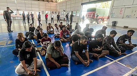 SURVIVORS sit after being rescued during a search and rescue operation off Pangkor Island, Perak, Malaysia in this handout image released by the Malaysian Maritime Enforcement Agency. A boat carrying 37 undocumented migrants believed to be from Indonesia capsized off Malaysia’s west coast, leaving 14 people missing.