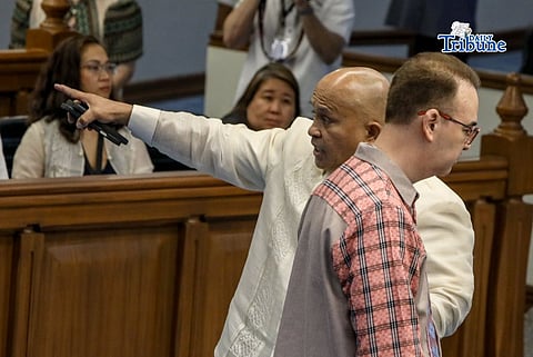 Senator Ronald "Bato" Dela Rosa (back) and Senator Alan Peter Cayetano during the Senate plenary session on Monday, 11 May.
