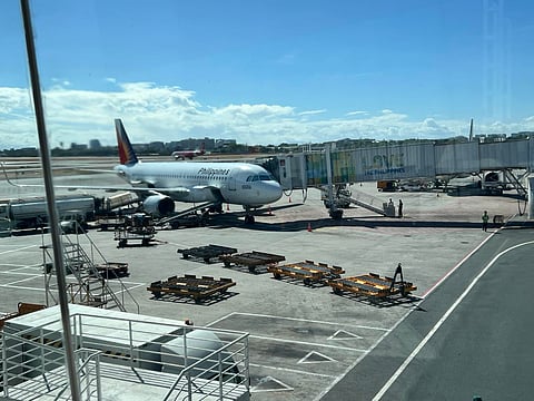 PAL airplane parked at NAIA Terminal 1