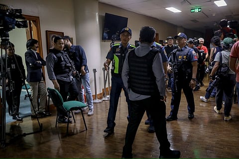 Authorities inside the Senate building on Wednesday, 13 May, after gunshots rang out from the building.