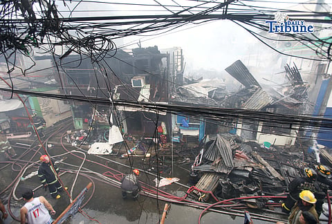 (May 14 2026) Firefighters responded the fourth-alarm fire that claimed the life of a 15-year-old boy at East Riverside, Barangay Paltok, Quezon City, on Thursday, May 14, 2026. Photo/Analy Labor