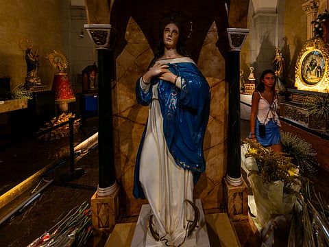 Tourists visit "Inay," an exhibition featuring images of Mary and the Child Jesus, at the Nuestra Señora del Pilar Chapel inside the Manila Cathedral in Intramuros, Manila on Sunday, 17 May 2026. The exhibit runs until May 31 as part of the annual Flores de Mayo celebration.