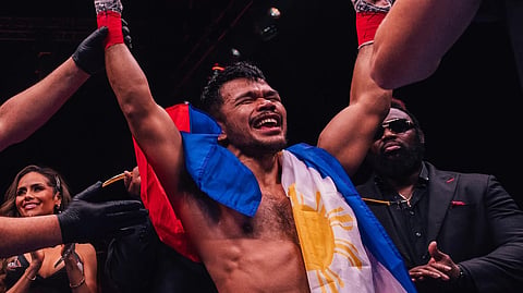 FILIPINO bare knuckle titleholder Rolando Dy celebrates his savage second-round knockout of two-time world boxing champion Paulie Malignaggi on Saturday night (early Sunday morning in Manila) in Manchester, England.