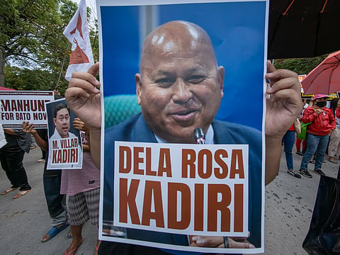 Human rights advocates march toward the Philippine Senate in Pasay City on 18 May 2026 as the chamber prepares to convene as an impeachment court against Vice President Sara Duterte. The protesters are demanding accountability for the escape of International Criminal Court fugitive Senator Ronald “Bato” dela Rosa, who allegedly slipped away while under the Senate’s protective custody.