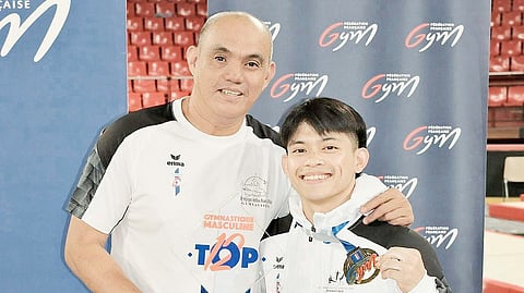 PARIS Olympics double gold medalist Carlos Yulo beams with pride alongside coach Aldrin Castañeda after helping his French club to victory in the Top 12 in Amiens.