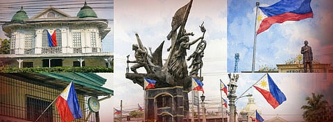 PHILIPPINE flags fly at a landmark in the City of San Fernando, Pampanga, ahead of the nationwide observance of National Flag Days. 