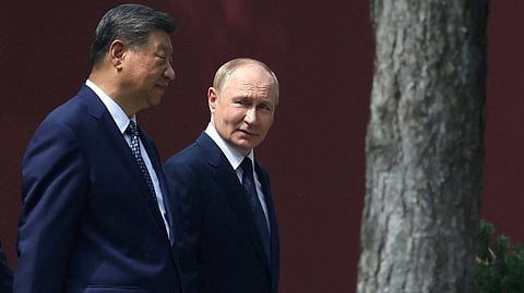 CHINESE President Xi Jinping and Russian President Vladimir Putin walk at the personal residence of the Chinese leader Zhongnanhai in Beijing, China.
