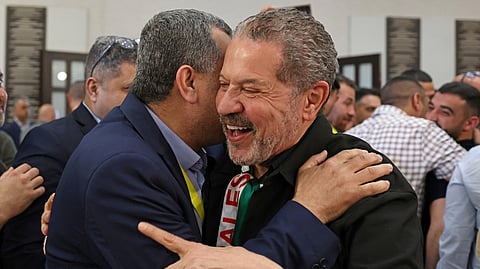 YASSER Abbas, newly-elected member of Fatah’s central committee, celebrates with a supporter in Ramallah in the occupied West Bank. The son of Palestinian president Mahmoud Abbas won a seat on Fatah’s top decision-making body, as initial results emerged from the Palestinian movement’s first congress in a decade.