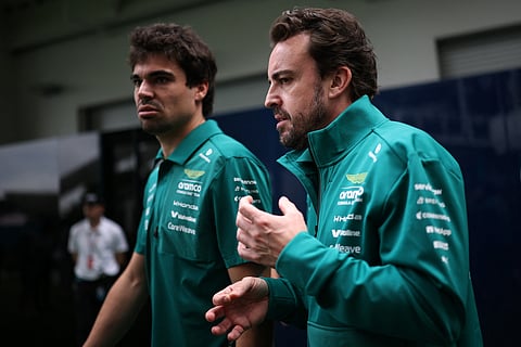 ASTON Martin teammates Fernando Alonso and Lance Stroll confer as Alonso adds his voice to drivers questioning F1’s energy-heavy new formula.