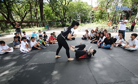 (May 23 2026) Professor Ayjell De Castro and Professor Alex Lee teach Jiu Jitsu basic self-defence skills to kids ages 10 to 15, at Quezon City Circle on Saturday May 23 2026, a free summer workshop conducted by Quezon City Government. Photo/Analy Labor