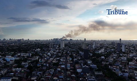 (May 23 2026) Smoke from the fire at Delpan Binondo Manila, that reached up to task force Charlie was seen from Quezon City, on Saturday May 23 2026. Photo/Analy Labor
