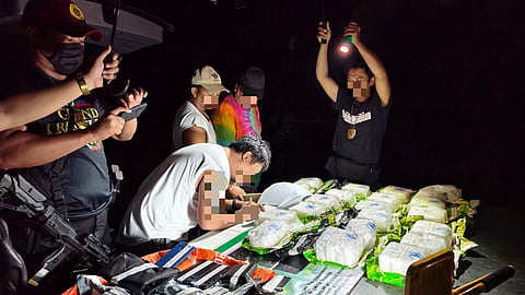 LAW enforcement and anti-narcotics operatives inspect around 20 kilograms of suspected shabu (methamphetamine hydrochloride) seized during a joint buy-bust operation in Purok Gaway-Gaway, Barangay Uling, Naga City, Cebu on 23 May. Authorities estimated the confiscated illegal drugs to be worth about P136 million.