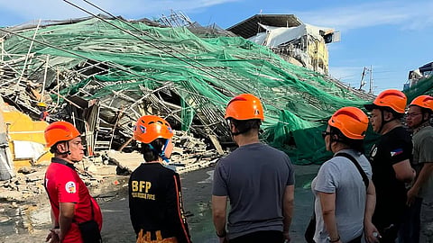 Rescue teams inspect the building that collapsed at Barangay Balibago in Angeles City, Pampanga on 24 May 2026.