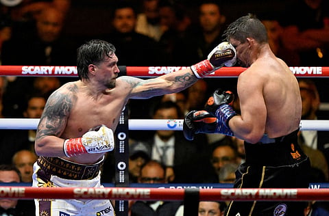 OLEKSANDR Usyk lands a punch on Rico Verhoeven during their WBC world heavyweight title match at the Pyramids of Giza in Egypt on Saturday.
