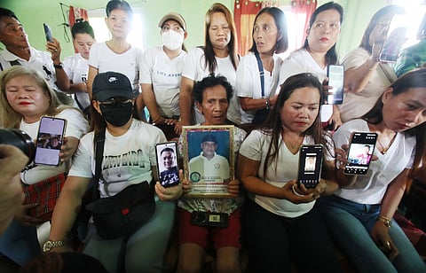 RELATIVES of missing sabungeros hold up photos of their missing loved ones during a press conference in Hagonoy, Bulacan, on Monday. The families denied allegations that they have abandoned the legal case, clarifying that they are not required to attend every court hearing unless specifically summoned. 