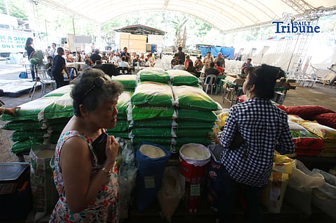 (May 25 2026) Individuals queue to buy affordable local or imported rice inside the Bureau of Animal Industry in Quezon City. Photo/Analy Labor
