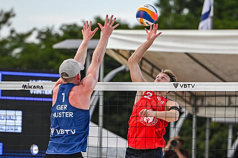 SWISS Jonathan Jordan attacks the defense of Germany’s Philipp Huster during their bronze medal match on Sunday in the Volleyball World Beach Pro Tour Nuvali Challenge in Santa Rosa, Laguna. Switzerland won in a reverse sweep, 18-21, 21-13, 15-13. 