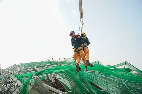 EMERGENCY workers conduct careful retrieval operations in Barangay Balibago, Angeles City. A unified command team is overseeing the site to coordinate a swift and safe recovery effort following the structural collapse.

