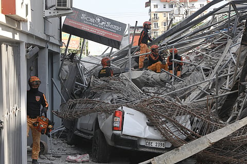 RESCUERS and retrieval team members scour the debris from the collapsed building along Teodoro Street, Barangay Balibago in Angeles, Pampanga on Wednesday.