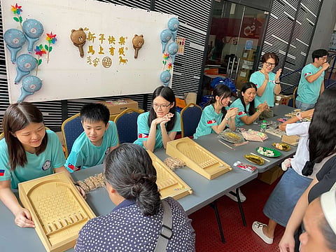 THE outreach program briefly became a night market, with participants crowding around games familiar to the streets of Taipei.