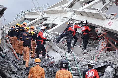 RESPONDERS race against time to locate possible survivors trapped inside a collapsed structure in Pampanga. Rescue radar equipment has detected four moving signals beneath the rubble at ground zero.