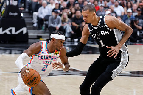Shai Gilgeous-Alexander #2 of the Oklahoma City Thunder drives against Victor Wembanyama #1 of the San Antonio Spurs in the second half of Game Six of the NBA Western Conference Finals at Frost Bank Center on 28 May 2026 in San Antonio, Texas. 