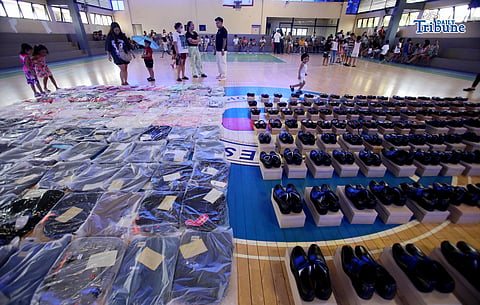 (May 30 2026)  Members of the Sangguniang Kabataan (SK) of Escopa III in Project 4 Quezon City, distribute shoes and bags for free to the children in their community a preparation for the year 2026 school opening, as part of their “Balik Eskwela” outreach program on Saturday May 30 2026. Photo/Analy Labor