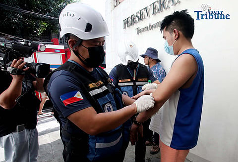 (May 30 2026)  Bureau of Fire Protection, Emergency Medical Services (BFP- EMS). Personnel providing first aid to the  first degree burn to  the one of the injured from the first alarm fire at Maningning corner Maamo street in Quezon City, on Saturday  May 30 2026. Photo/Analy Labor
