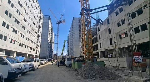 Photo is from the DHSUD’s social media page shows a condomonium-type housing project in Manila in various stages of construction.