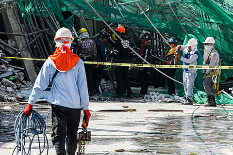 RETRIEVAL efforts continue at the collapsed building along Teodoro Street, Barangay Balibago, Angeles City, Pampanga. As of 5 p.m., authorities have recovered nine bodies from the site.