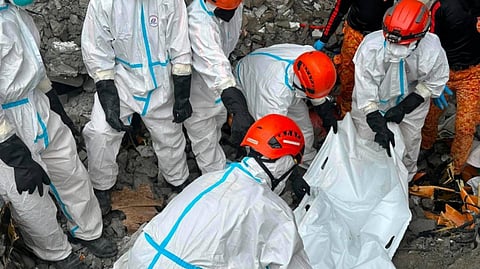 RESCUERS extricate the 13th confirmed casualty from the collapse site of a structure in Pampanga, as recovery operations continue.