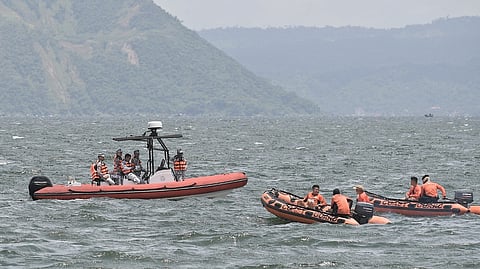 PHILIPPINE Coast Guard personnel depart for Lake Taal, Talisay, Batangas — south of Manila. Search teams scoured the lake for remains of dozens of cockfighters allegedly murdered and dumped there by rogue elements.
