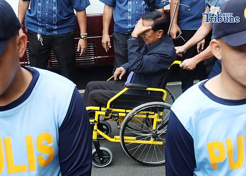 Former DPWH Secretary Manuel Bonoan being escorted out of the Sandiganbayan and back to the PNP General Hospital in Camp Crame, Quezon City after attending his arraignment hearing on Tuesday, 2 June.