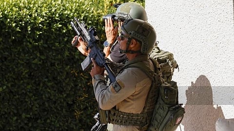 ISRAELI soldiers react after taking cover near the Israel-Lebanon border following a Hezbollah drone attack over the northern border.