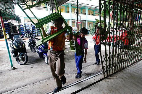 BOY Scout volunteers assist in cleaning and preparing the campus during the annual Brigada Eskwela at Aurora A. Quezon Elementary School in San Andres, Manila, on Tuesday. The five-day volunteer campaign mobilizes community support to prepare classrooms and school facilities ahead of the official opening of classes next week.