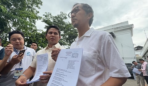 Assistant Ombudsman Mico Clavano and DPWH Secretary Vince Dizon arrived at the Malolos Regional Trial Court to file complaints against St. Timothy Corporation and several officials of the DPWH Bulacan 1st District Regional Office.