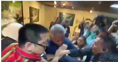SUITCASE smackdown Series of photos captures the scuffle between Interior and Local Government Secretary Jonvic Remulla (in blue shirt) and Senator Robin Padilla (in striped red shirt) before the start of the Blue Ribbon Committee hearing on the testimonies of 18 Marines who witnessed the distribution of cash-filled suitcases in the Floodgate scandal.