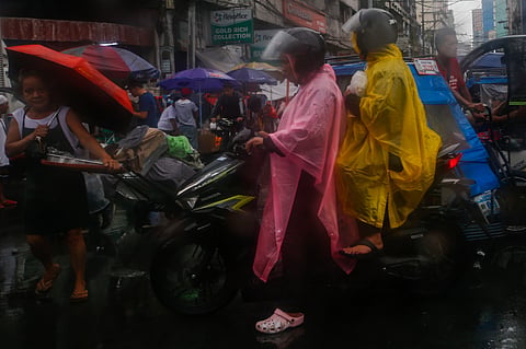 Motorists and commuters in Divisoria, Manila brave intermittent rains brought by Tropical Depression Ester, which has enhanced the southwest monsoon. The downpour comes shortly after PAGASA officially declared the start of the rainy season.