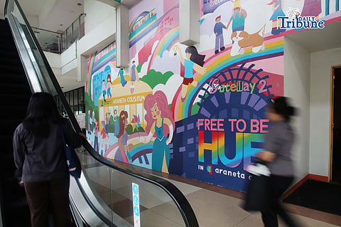(June 05 2026) Pedestrians walk past the Mural titled “Free to be HUE” at Araneta City in Cubao Quezon City, on Friday June 5 2026. The mural stands as a symbolic and lasting expression of Araneta City’s commitment to inclusivity, acceptance, and self-expression, honoring the LGBTQIA+ community as the celebration of Pride Month starts. Photo/Analy Labor
