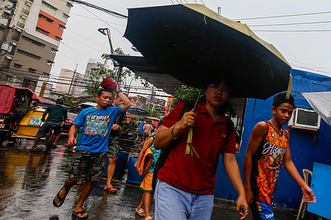 COMMUTERS in Manila brave intermittent rains brought by tropical depression ‘Ester,’ which enhanced the southwest monsoon. The downpour comes days after PAGASA officially declared the start of the rainy season.