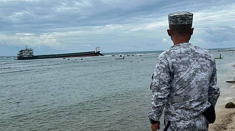 THE cargo vessel LCT MSCI 1 sits aground near the shoreline of Barangay La Virgen Milagrosa in Badoc, Ilocos Norte on Monday. According to local authorities, the vessel was carrying aggregates bound for Calayan Island, Cagayan, when severe weather forced the crew into an emergency beaching.