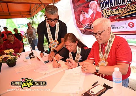 Congressman Carmelo “Pogi” Lazatin, Jr., in his capacity as Company President, signs the Deed of Donation of the property owned by Biotop Philippines Agriculture Co. to Barangay Sapalibutad, Angeles City, represented by Barangay Captain Cristina Pineda.