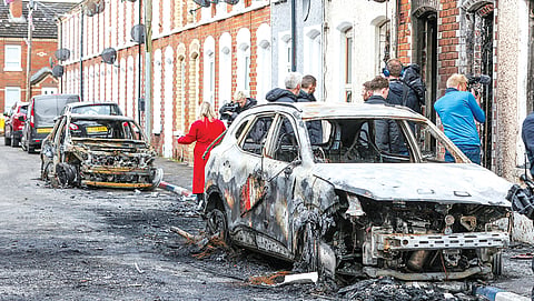 Belfast girds for more violence after stabbing suspect held