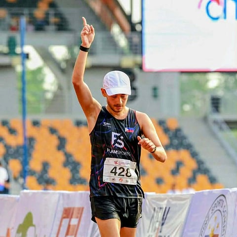FIL-GERMAN race walker Nathaniel Seiler flashes the No. 1 sign as he finishes first in the men’s 10-kilometer walk in record-breaking fashion Thursday in the ICTSI Philippine Athletic Championships at the New Clark City Athletic Stadiumin Capas, Tarlac.