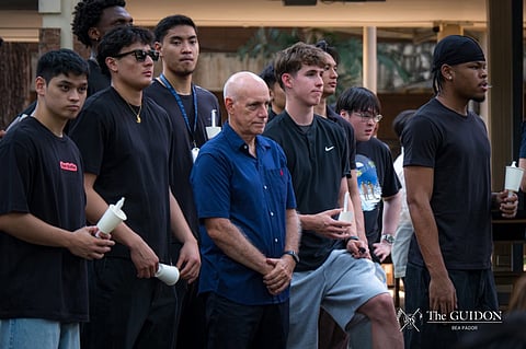 ATENEO basketball head coach Tab Baldwin makes his first public appearance during a candlelight vigil ceremony on Thursday at the school’s Quezon City campus.