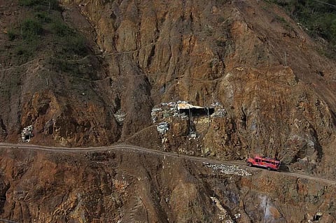 A PASSENGER jeepney navigates the rugged and hazardous roads leading to Barangay Luneta in Itogon, Benguet. The mountain landscape shown above is a common sight in the municipality, dubbed the ‘Land of Golden Opportunity,’ where many slopes have been transformed into settlements by small-scale miners.