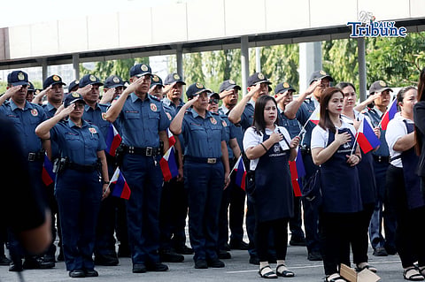 (June 12 2026) Members of the local Philippine National Police (PNP), Boy Scouts of the Philippines (BSP) and mall employees waving flags as they attend a cultural flag raising ceremony to mark the 128th Philippine Independence Day at SM Marikina on Friday, June 12 2026. Photo/Analy Labor 