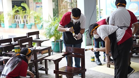 ABOITIZ Future Leaders scholars volunteered their time to paint armchairs at Krus Na Ligas Elementary School in Quezon City as part of Brigada Eskwela, helping prepare the campus for academic year 2026 to 2027.