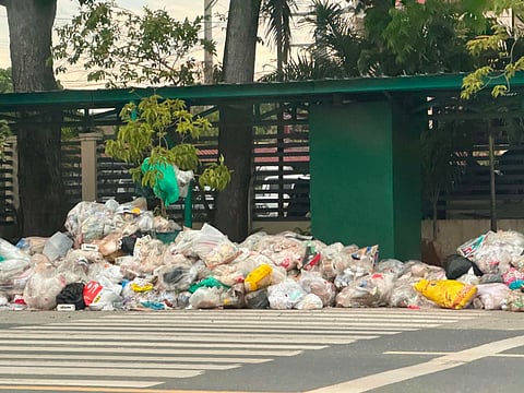 Sacks of waste were dumped on June 5, Friday, at the front of DENR Region 11 (DAVAO). The illegal dumping was allegedly linked to Davao Mayor City Sebastian Duterte's order following the closure of the city landfill at Tugbok, New Carmen. (PHOTO COURTESY of One Mindanao). 