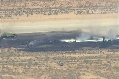 SMOKE rises from a blackened part of Edwards Air Force Base after the crash of a US Air Force B-52 bomber aircraft in Edwards, California, US, in a still image from news helicopter video. 